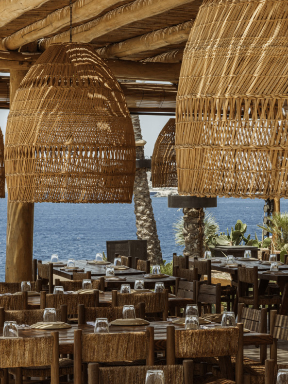 The beachside lair encompasses a sandy beach, open-plan restaurant, and ...